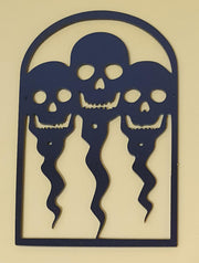 Black laser-cut acrylic Halloween decoration featuring three ghostly skeleton figures with skull faces inside a gothic arched frame.