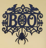 Black laser-cut acrylic BOO Halloween decoration featuring flying bats, spiderwebs, gothic flourishes and a large hanging spider.