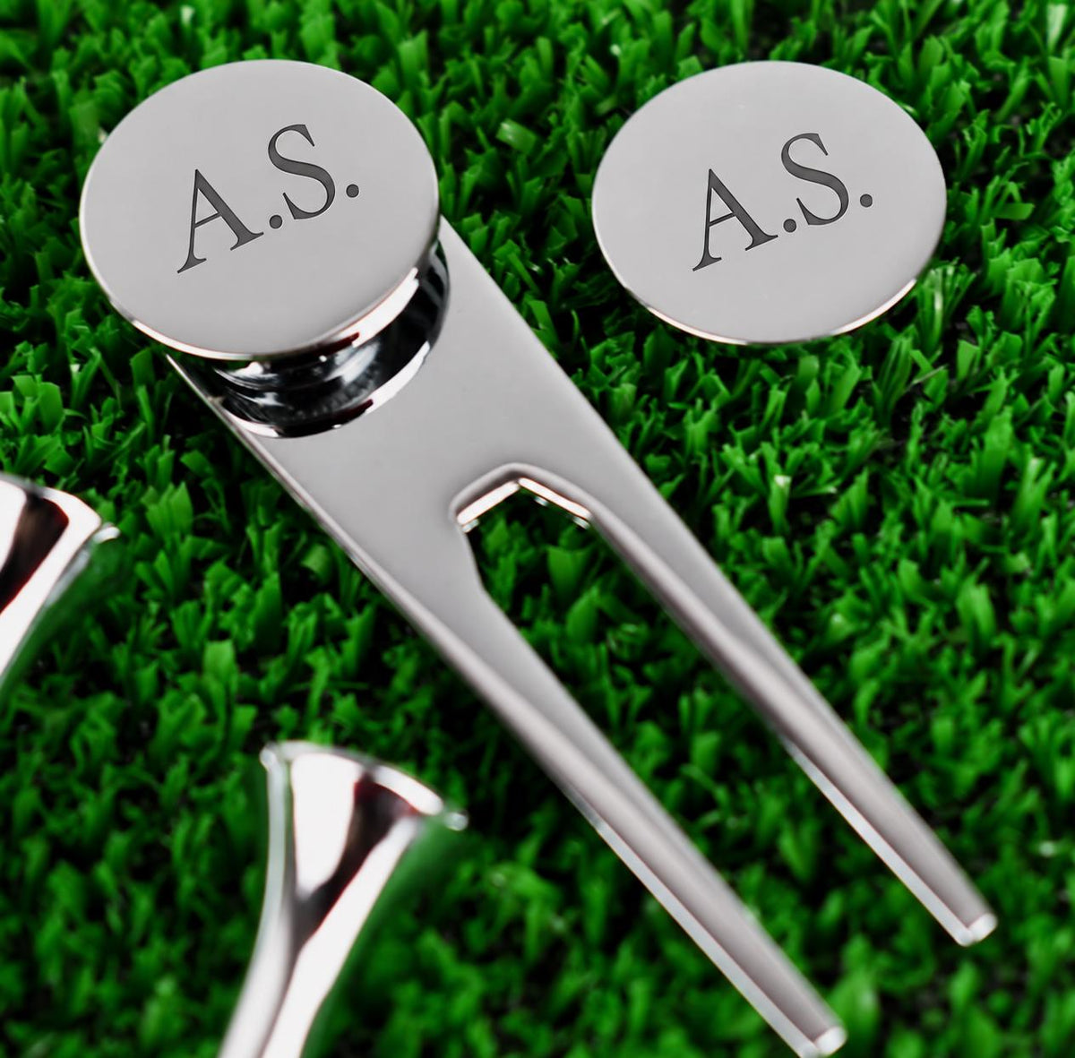 Golf gift set displayed in its case with three tees, pitch repairer and personalised ball marker.