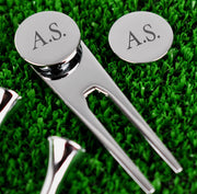 Golf gift set displayed in its case with three tees, pitch repairer and personalised ball marker.