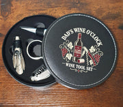 Open Dad’s Wine O’Clock wine tool case showing the printed lid and four fitted wine accessories.