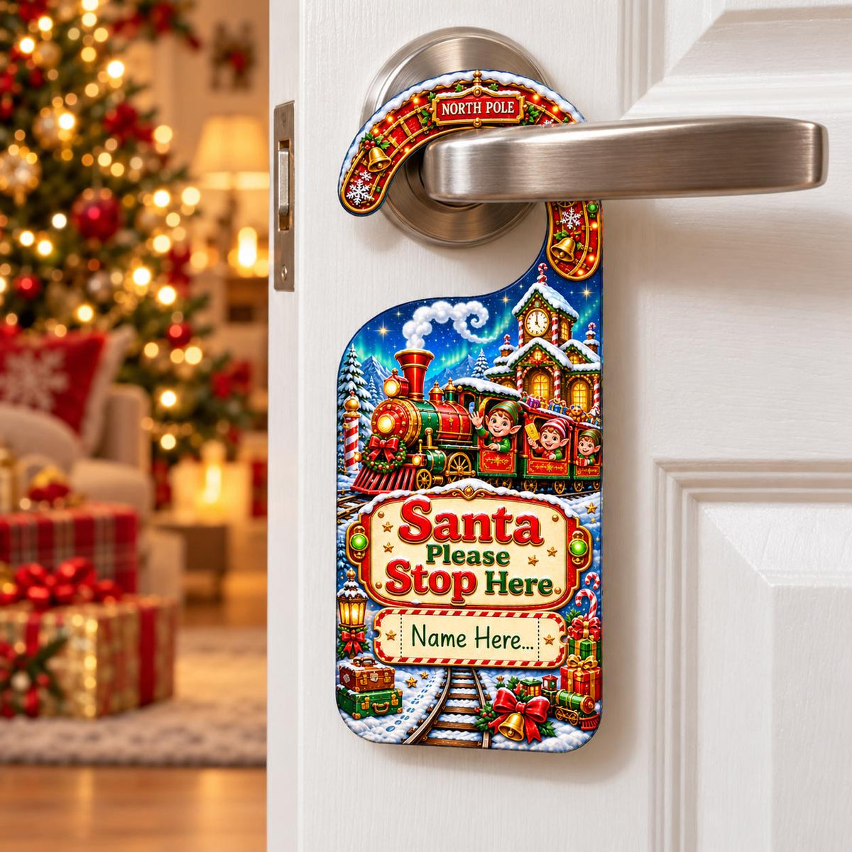 Personalised Santa Please Stop Here door hanger showing three elves aboard a Christmas train, with a ticket-shaped name panel.