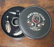 Open Mum’s Wine O’Clock gift case showing the corkscrew, bottle stopper, drip collar and wine pourer.