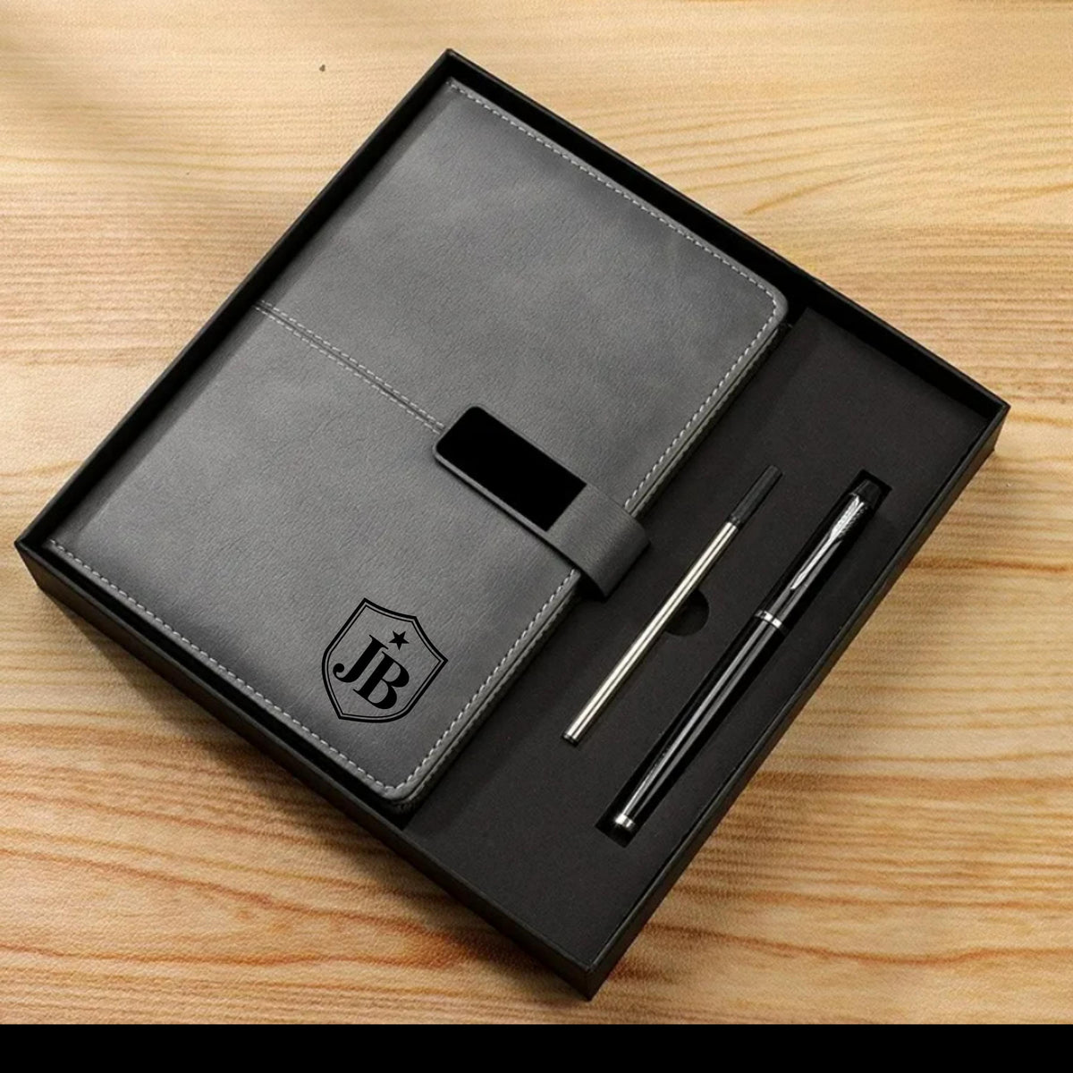 Personalised A5 PU leather notebook with a textured cover, custom name design and matching ballpoint pen.