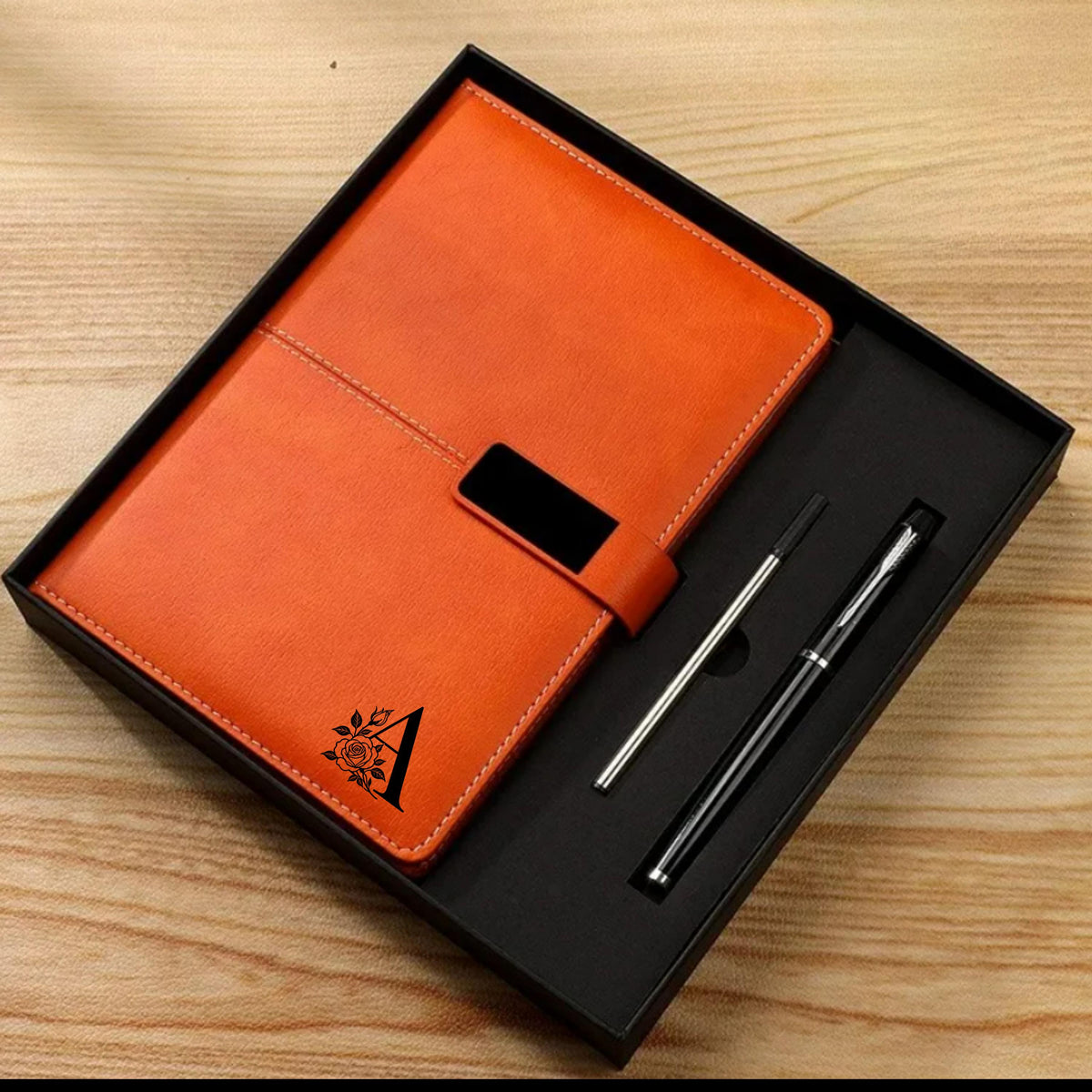A5 notebook and pen set available in orange, brown, grey, blue and red, with personalised cover options.