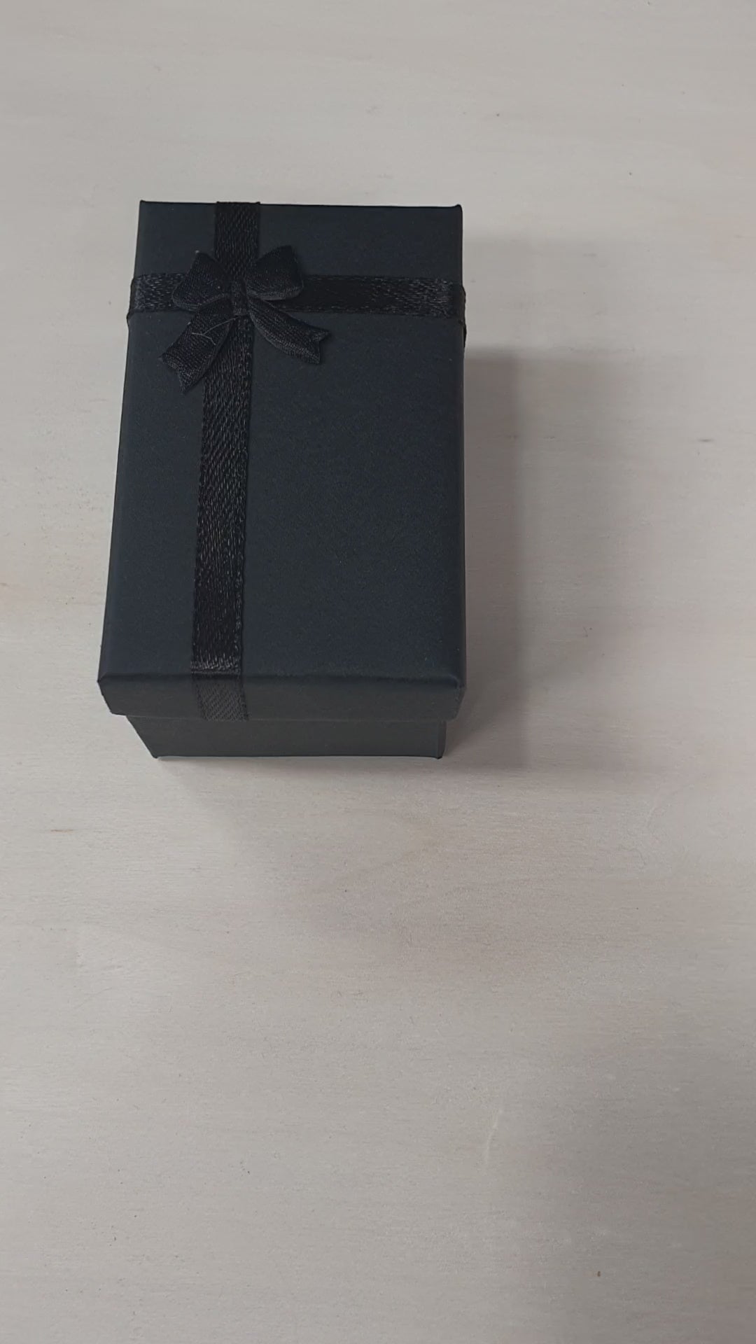 Load video: Personalised photo keyring with custom printed picture on a polished rectangular metal keychain. Presented in a black gift box with ribbon, perfect for adding a favourite family, baby, pet or memorial photo as a thoughtful keepsake gift.