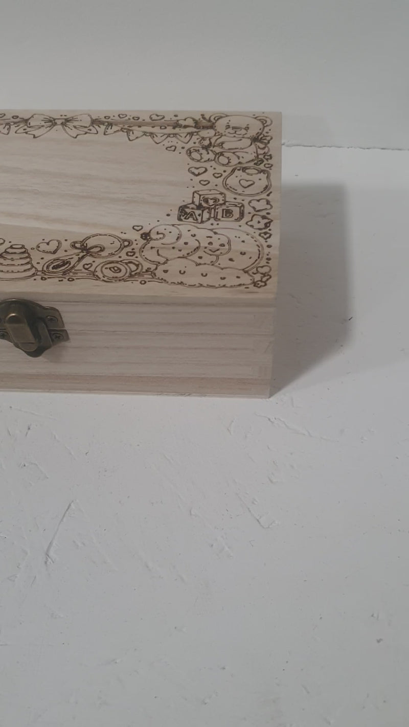 Aerial view of personalised wooden baby keepsake box engraved with baby name and date of birth