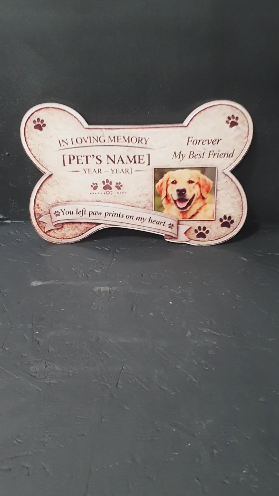 Load video: Personalised pet bereavement plaque, bone shaped remembrance tribute for dogs and cats with name and dates.