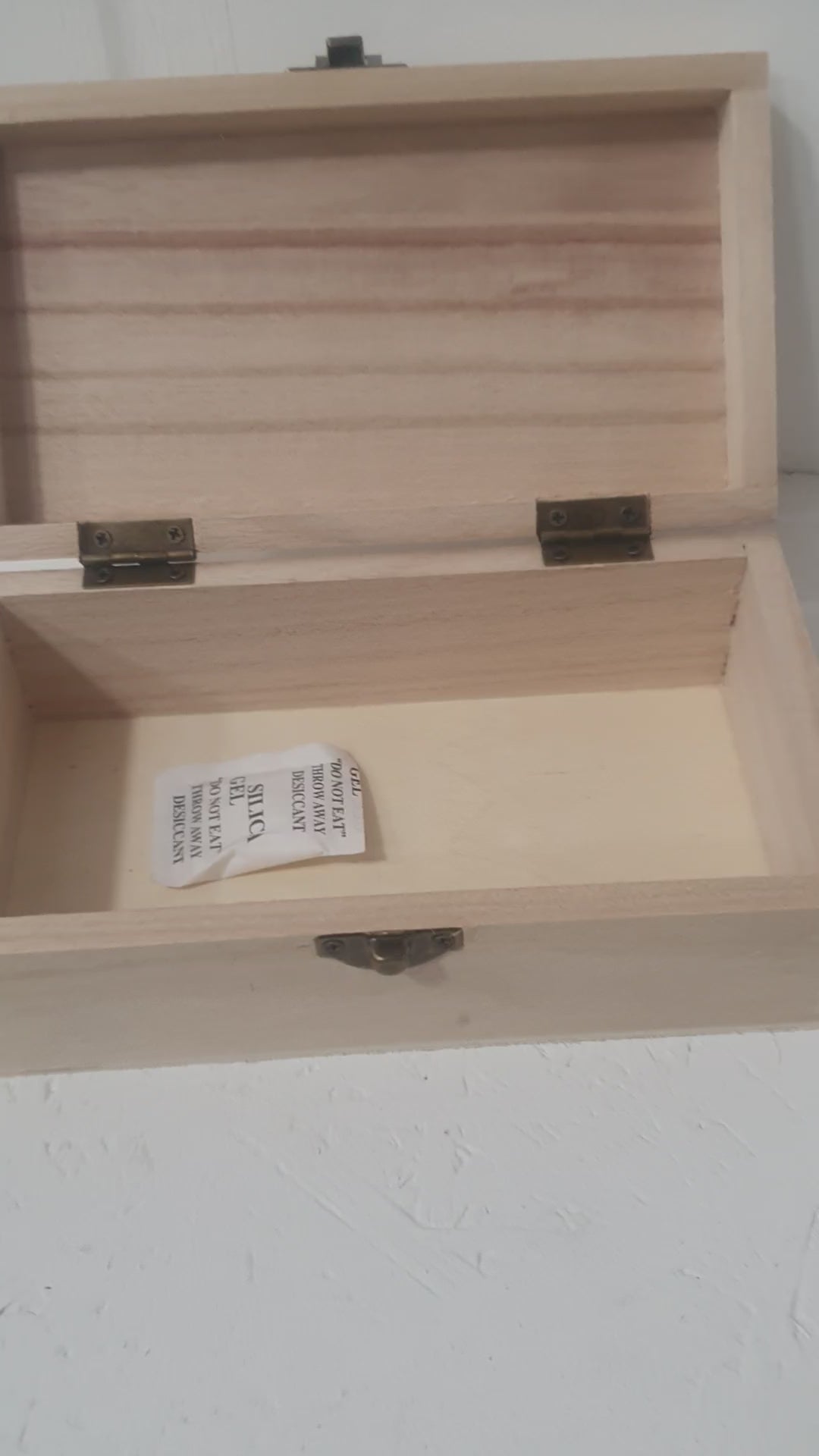 Load video: Personalised wedding honeymoon memory box holding travel souvenirs, photos and keepsakes.